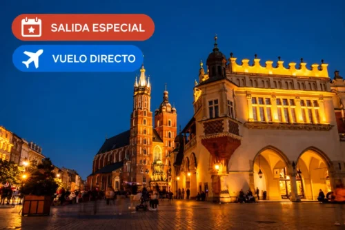 Plaza del Mercado de Cracovia iluminada al anochecer, con distintivos de salida especial y vuelo directo.